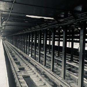 black & white photo of the subway track in New York