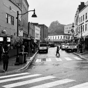 a black and white photo of a main street in Juneau Alaska